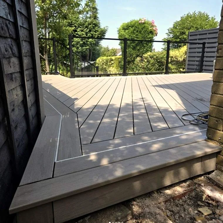 Trex composite decking installed in a South Wales garden with lighting