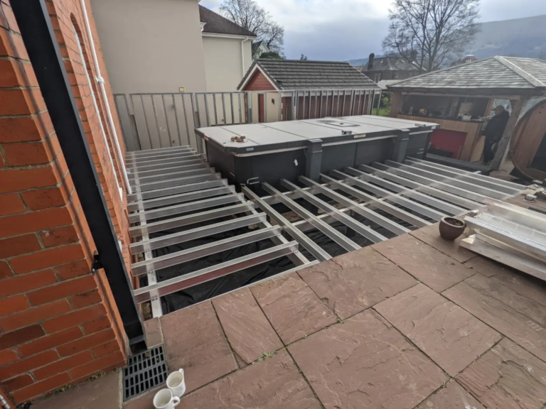 Aluminium deck frame around a hot tub