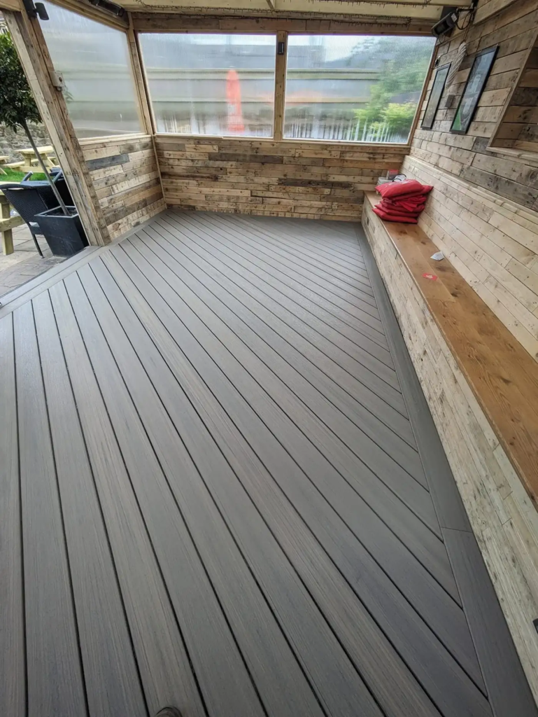 Finished Trex deck with bench seating at The Grofield, Abergavenny