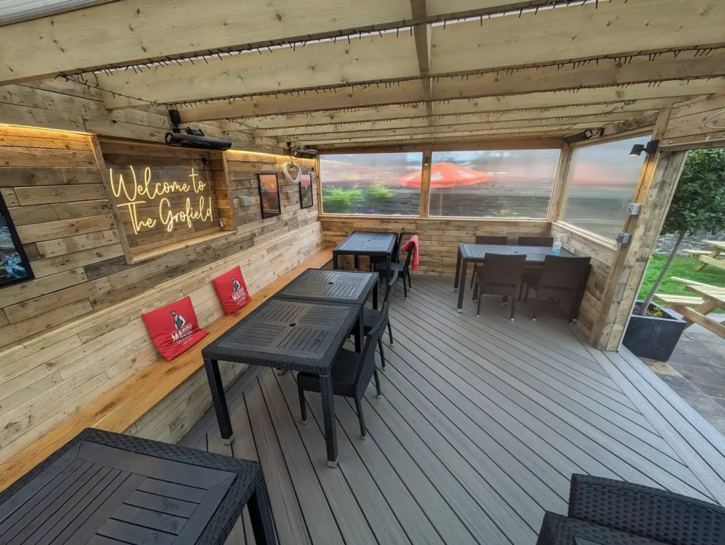 Covered Trex seating area at The Grofield pub, Abergavenny