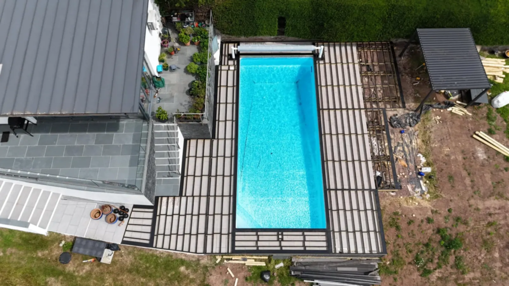 Aerial view of a composite pool deck built by Ellis Decks