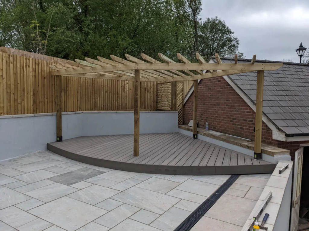 Curved composite deck under a timber pergola
