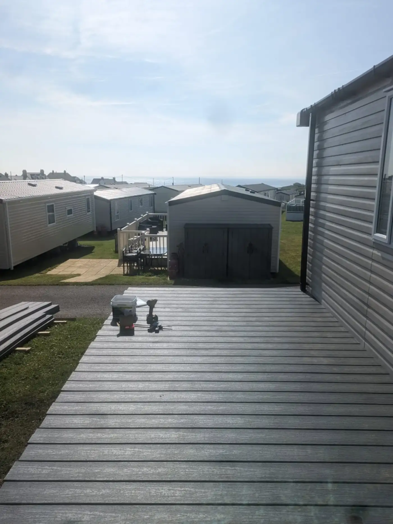 A static caravan pitch at a holiday park in Port Eynon