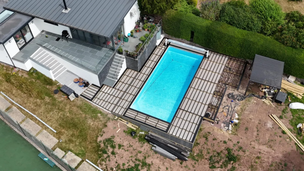 Drone view of the Raglan pool deck being extended, with the new frame laid out around the pool