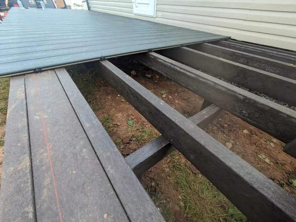 Deck frame going in beside a static caravan